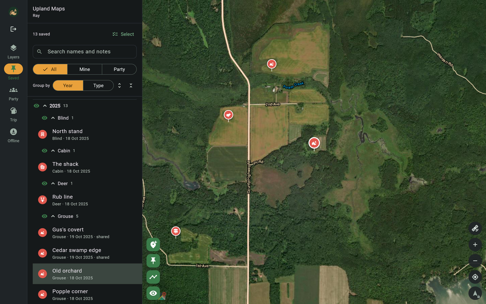 Saved marks listed beside aerial imagery with pins dropped on the ground